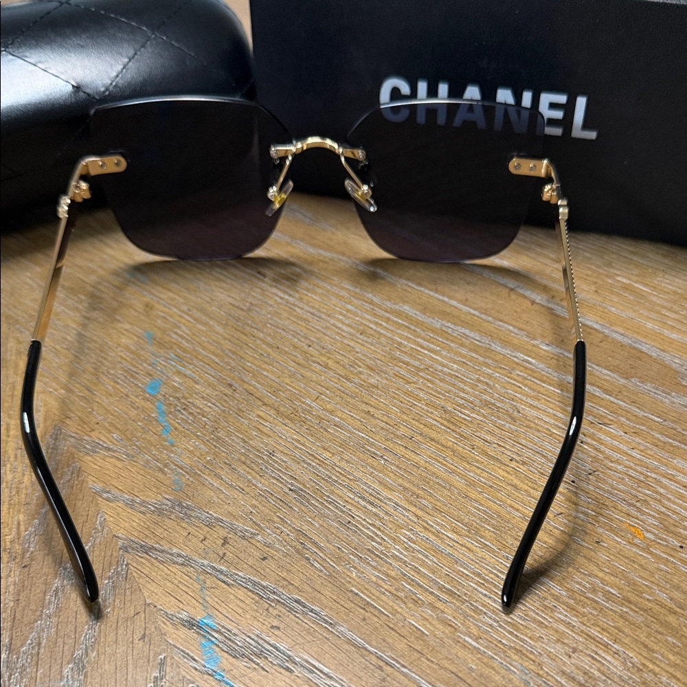 CHANEL Black Rimless Square Sunglasses with Gold Accents - Picture 9 of 9